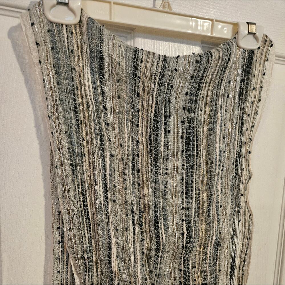 Woman's multi-colored scarf with metallic threads and fringe